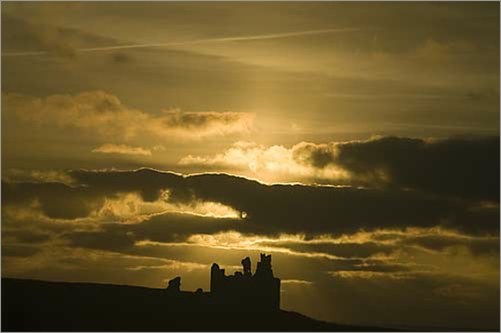 Dawn over Dunstanburgh Castle